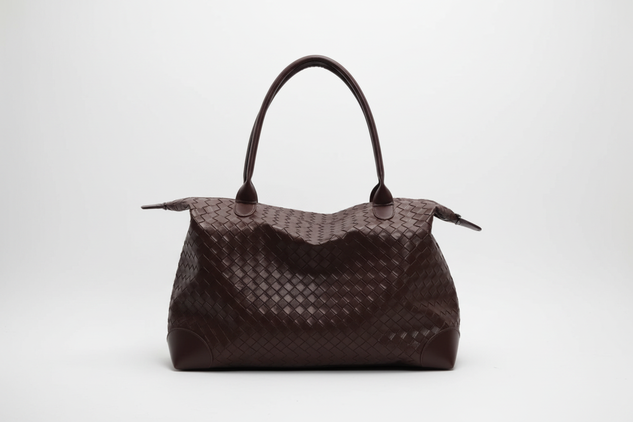 Brown woven handbag on a white background